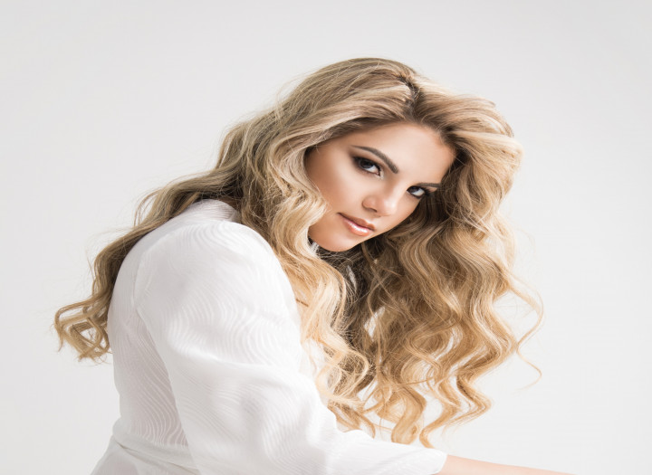 I will deliver high-end female vocals for your song pop / cinematic